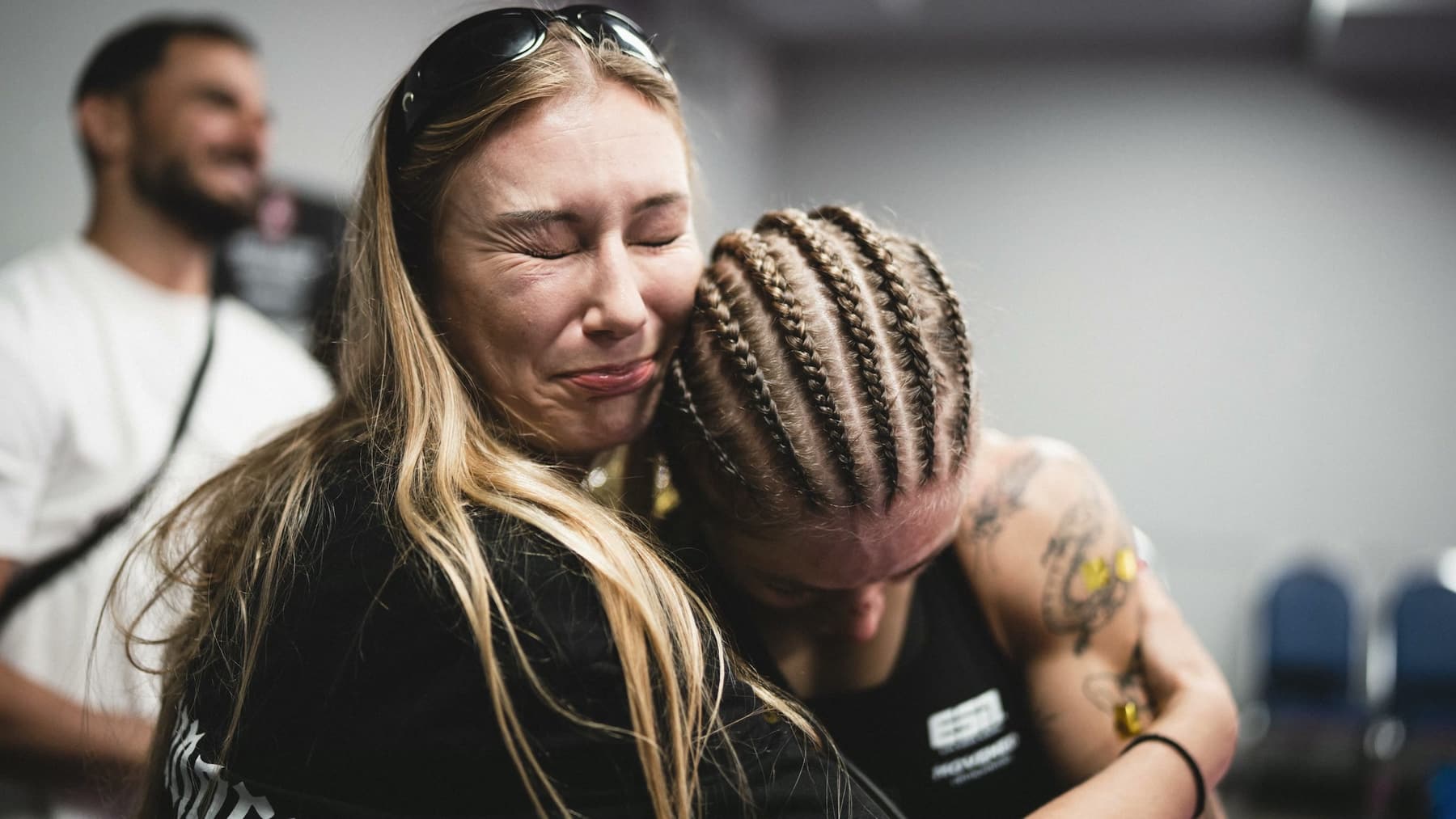 Stella Hemetsberger embracing a member of her team backstage