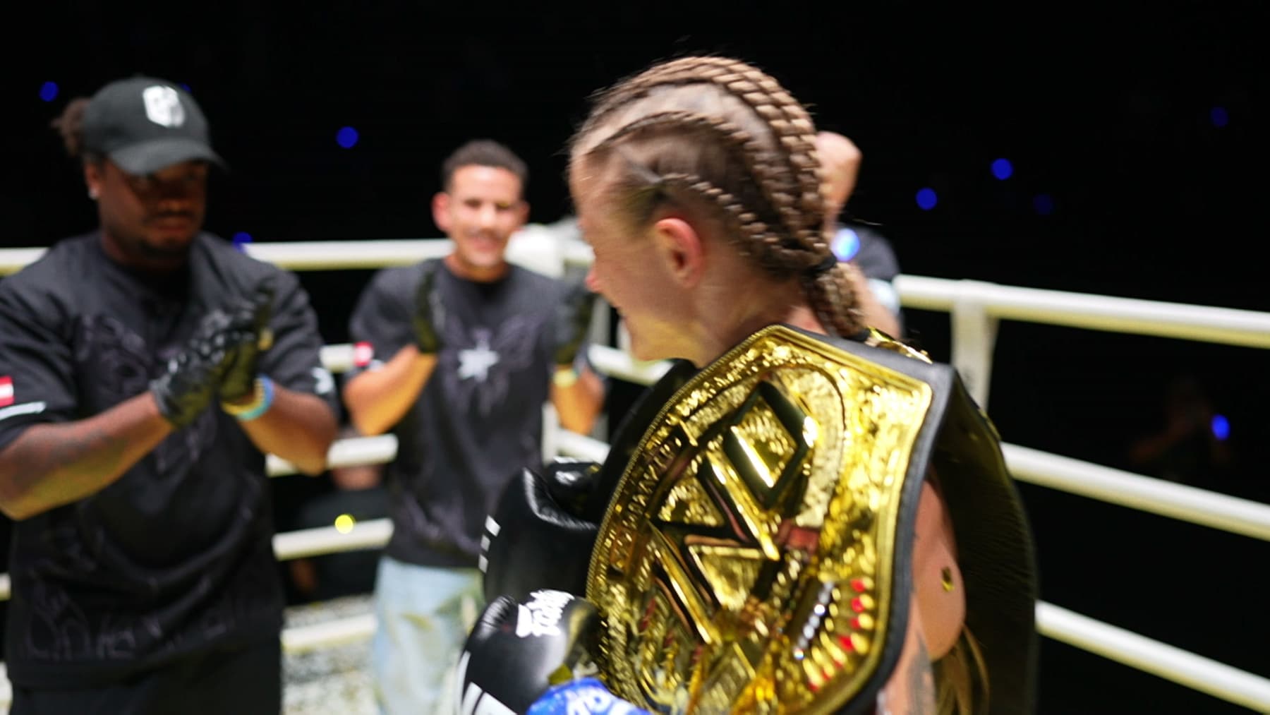 Stella Hemetsberger carrying her ONE world title belt